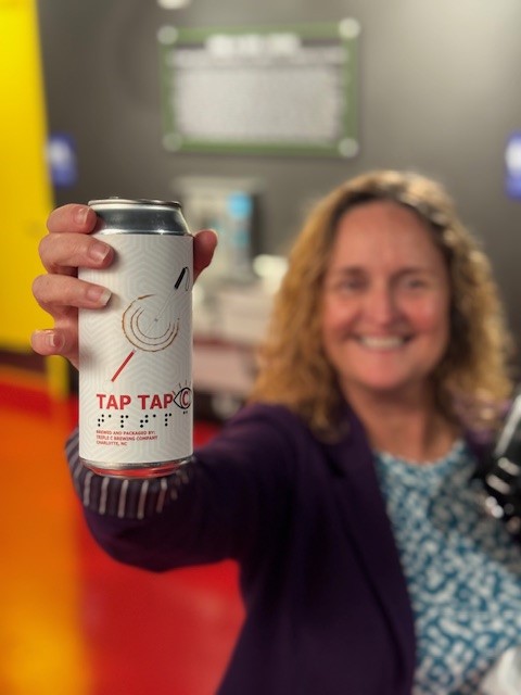 Dana A. Draa holding Tap Tap C can